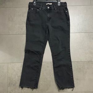 Levi’s mid rise 505 black denim distressed cut jeans